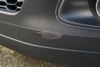Close-up of a scuff on the front bumper